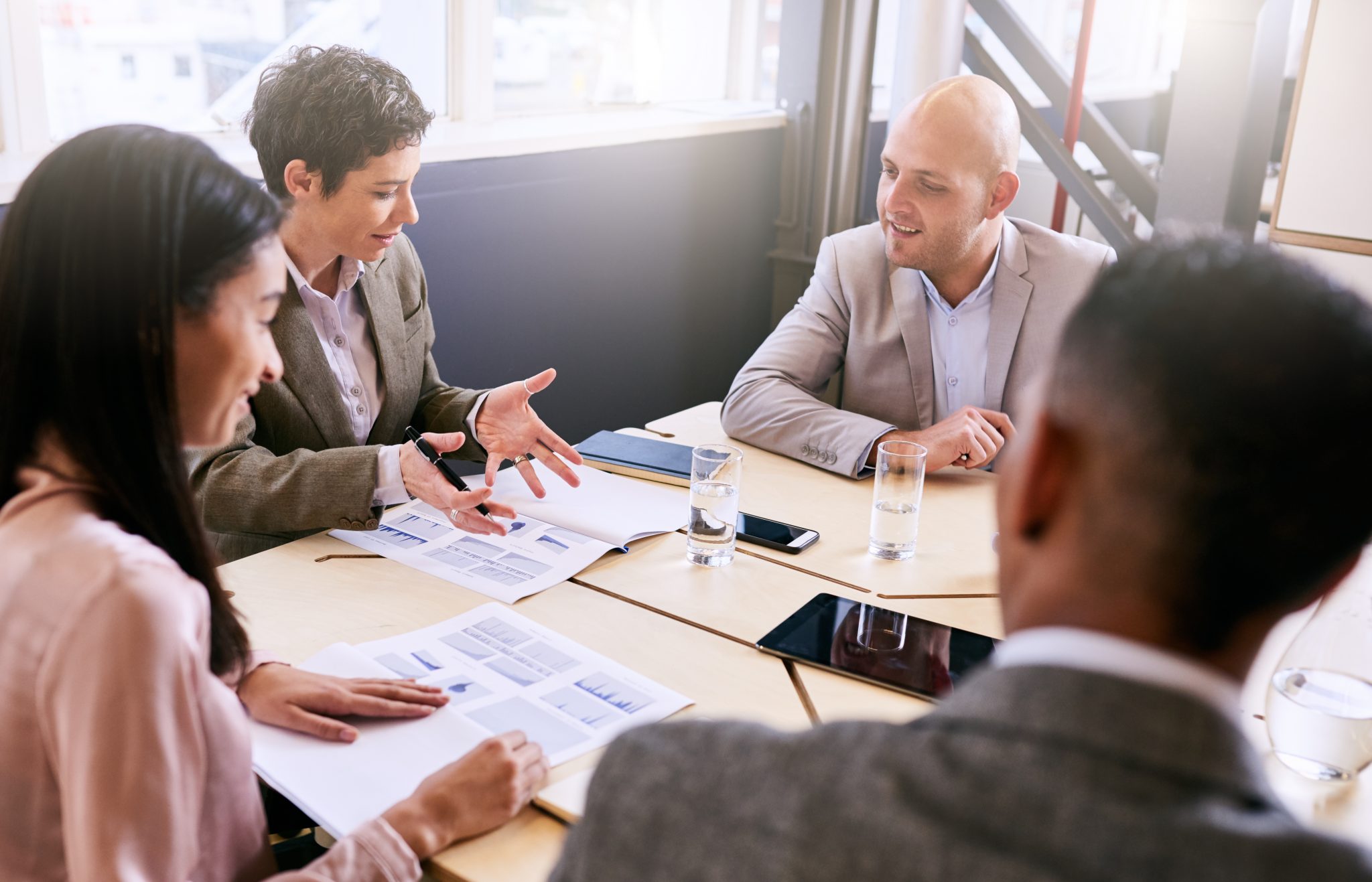 businesswoman using hand gestures to explain her financial analysis