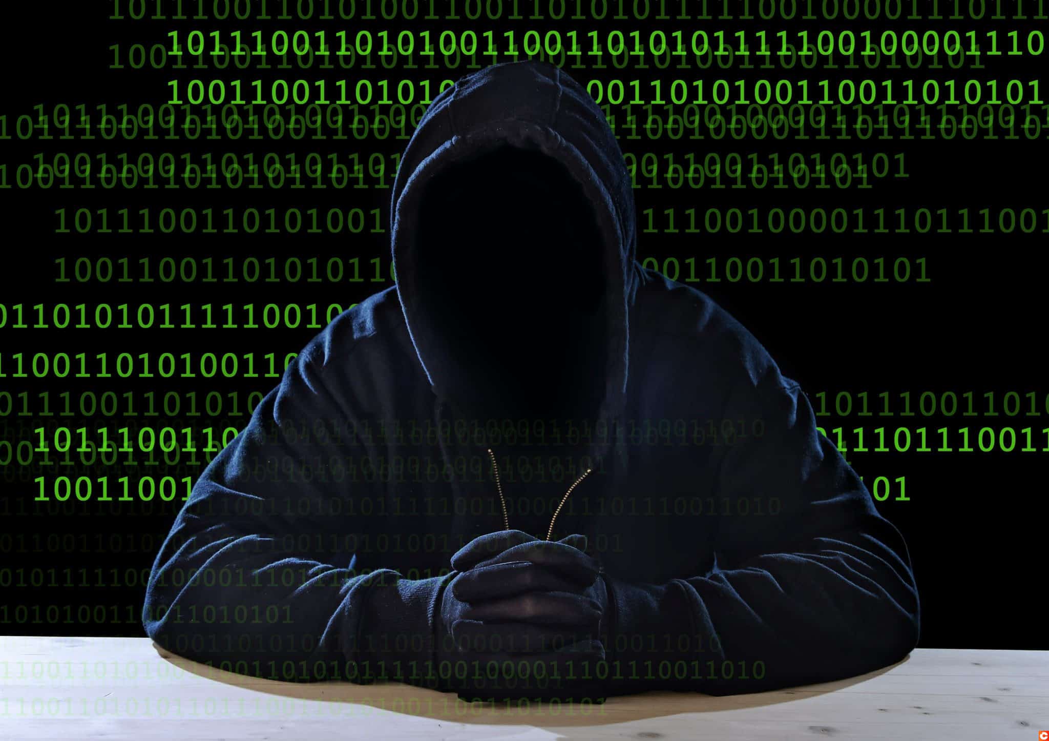 hacking expert man in hood as sensitive information cracker cyber crime concept