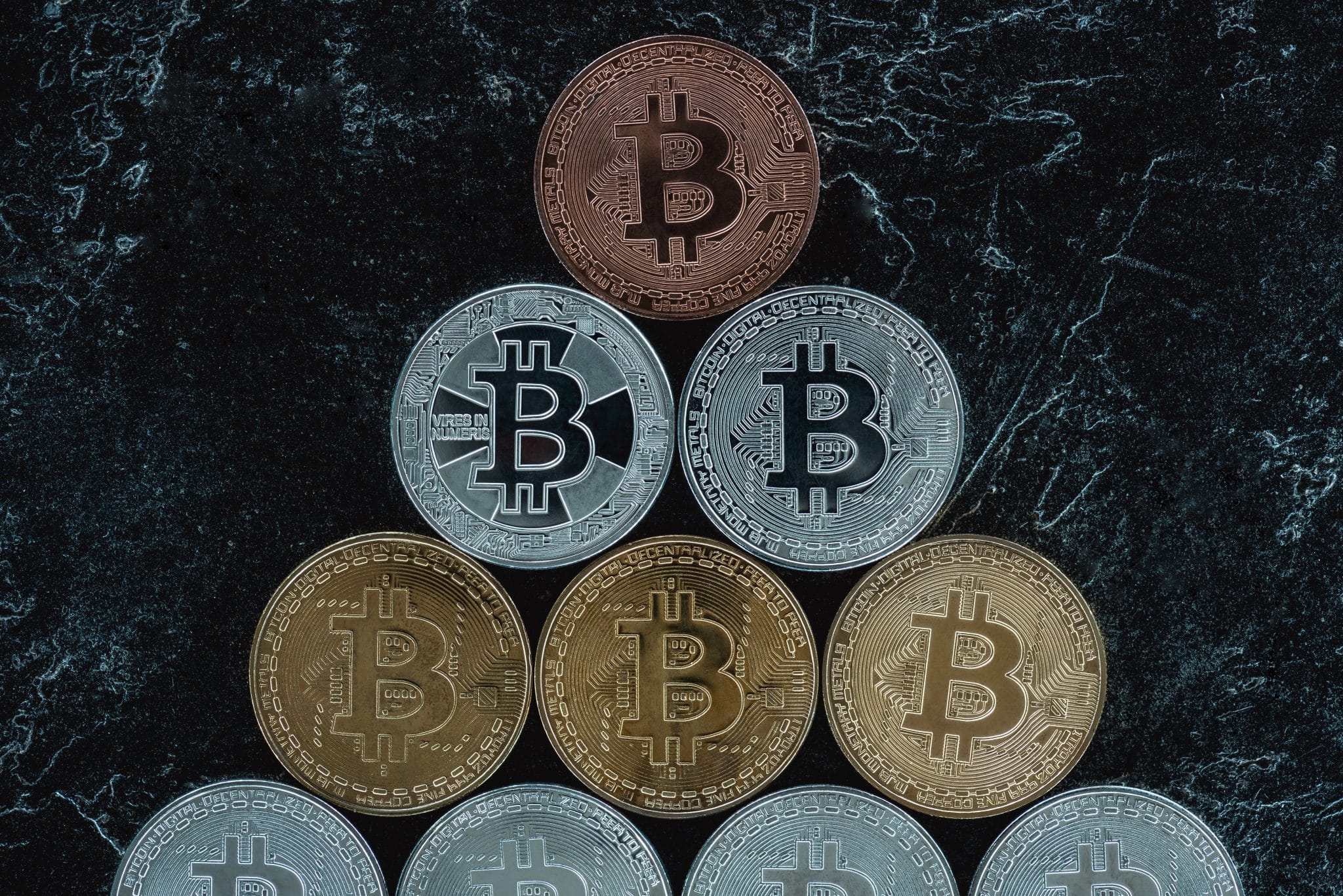 top view of arranged bitcoins on marble tabletop