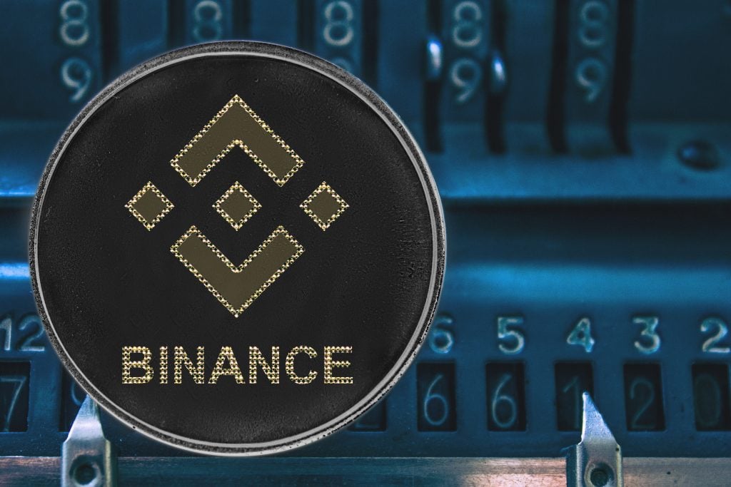Coin cryptocurrency bnb against the numbers of the arithmometer. binance
