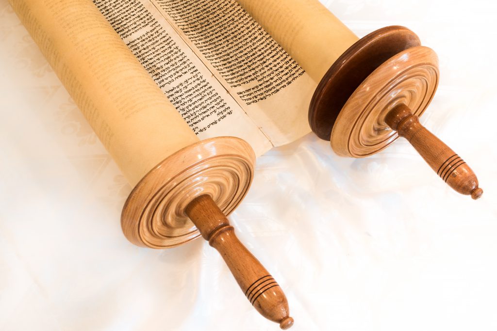 The Hebrew handwritten Torah scroll, on a synagogue alter, illustrating Jewish holidays, during fests. Closed version
