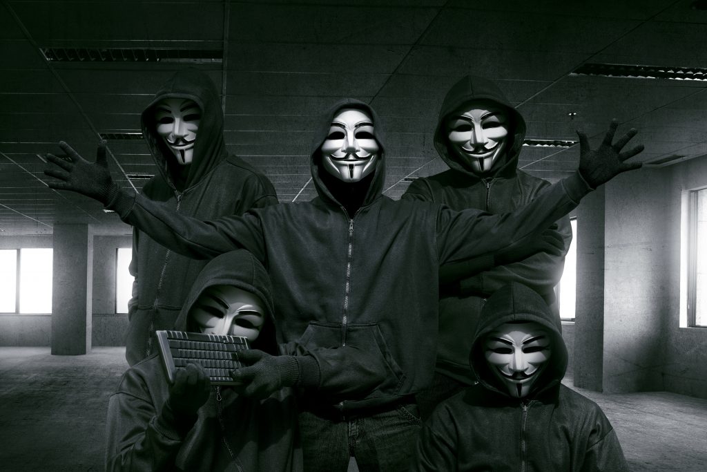 hackers in masks with keyboard