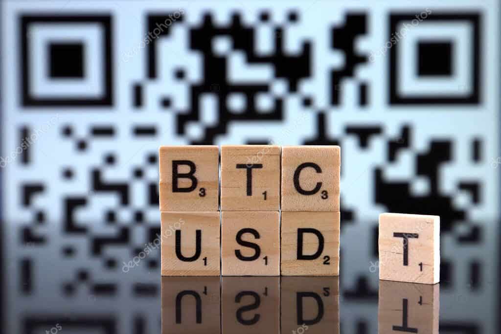 WROCLAW, POLAND - FEBRUARY 04, 2020: Words BTC USDT made of small wooden letters. Tether (cryptocurrency, USDT) is called a stablecoin because it was originally designed to always be worth $1.00.