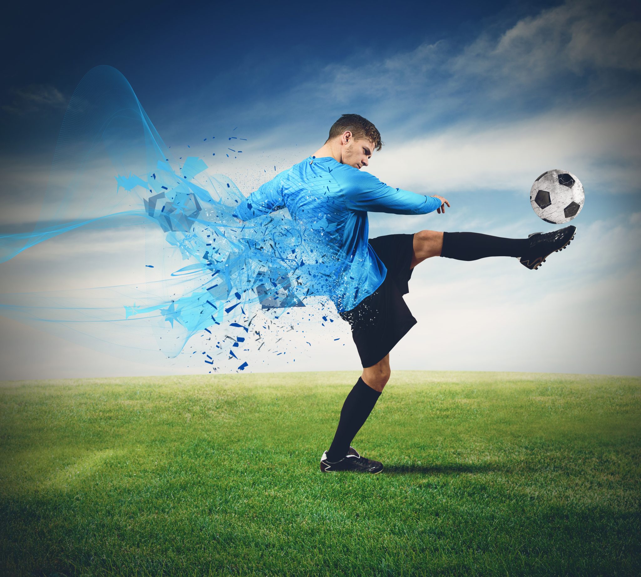 Soccer player kicks ball