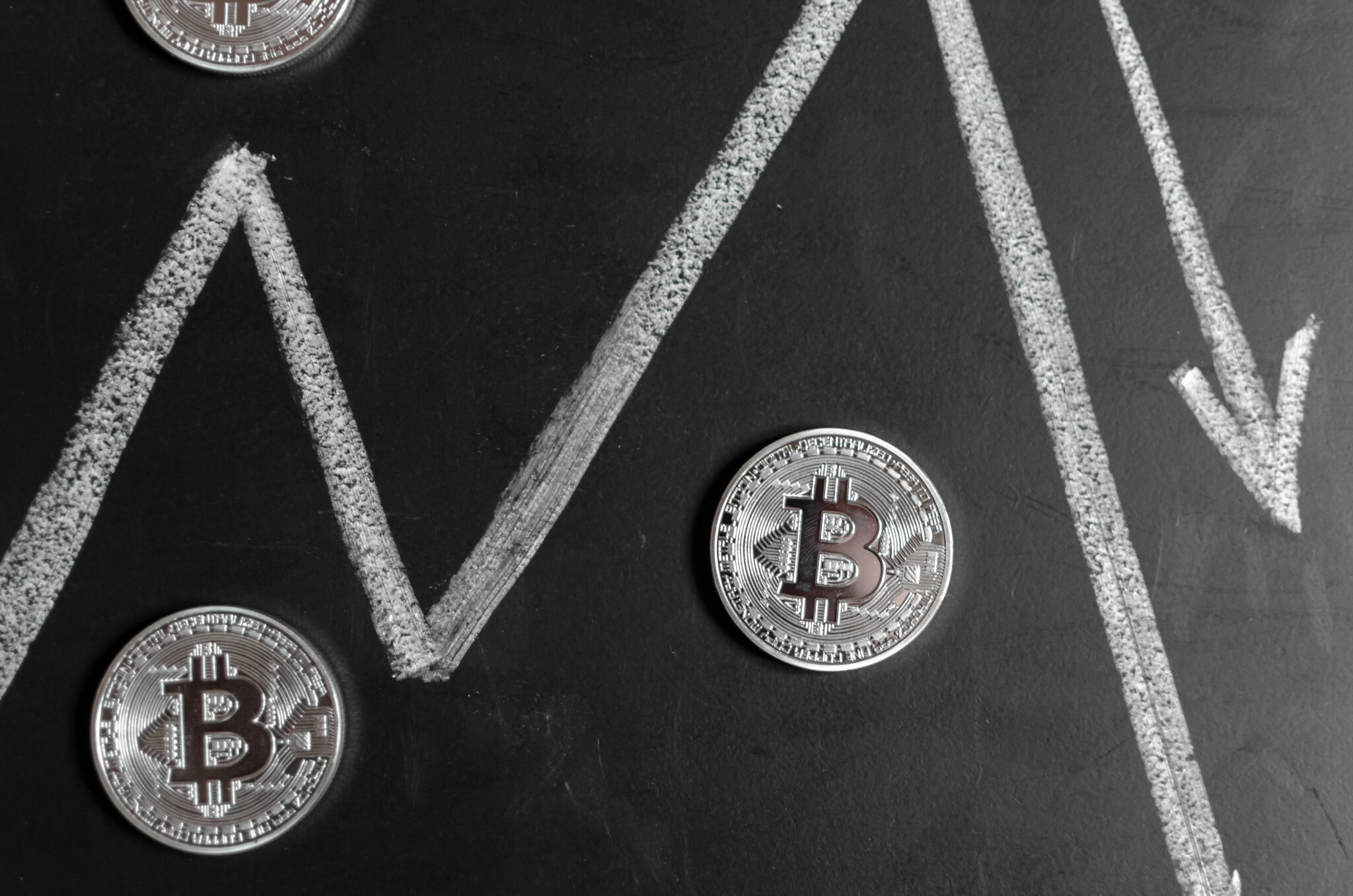 Bitcoins replica on black chalkboard background
