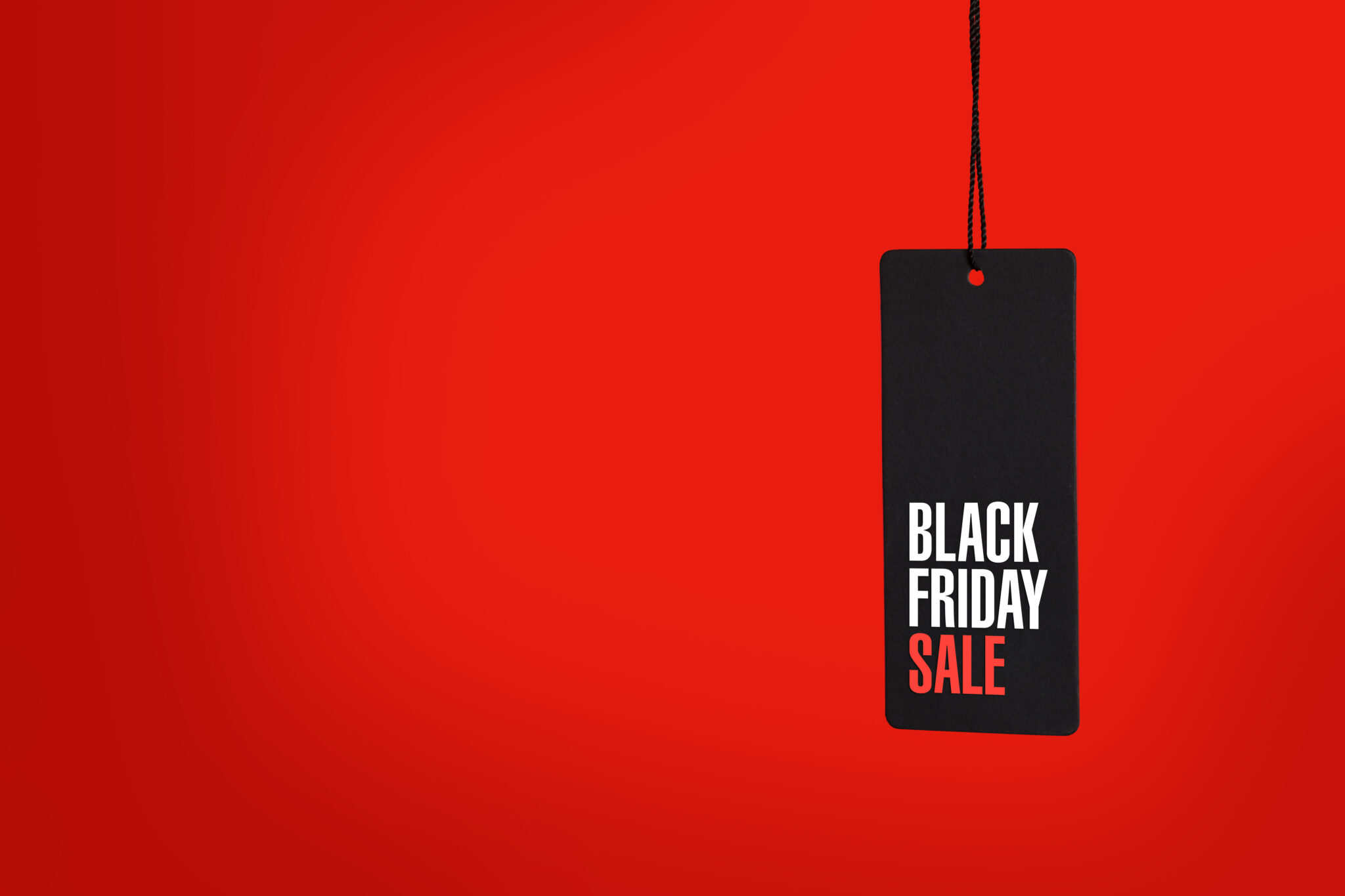 Black friday. Sale tag on red background