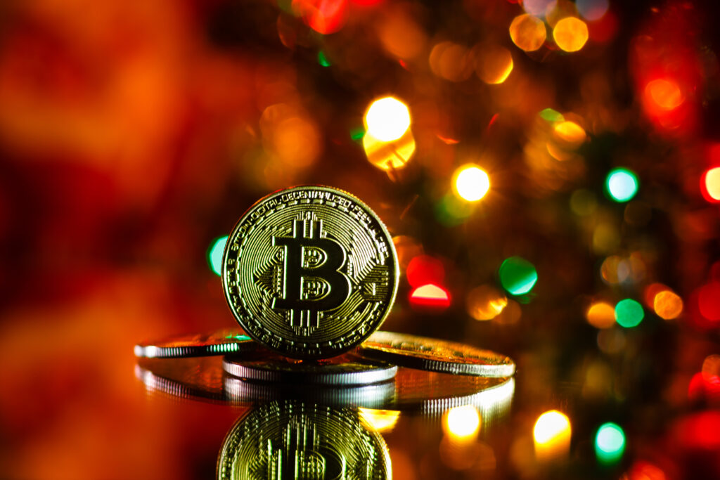 gold bitcoins on red Christmas background