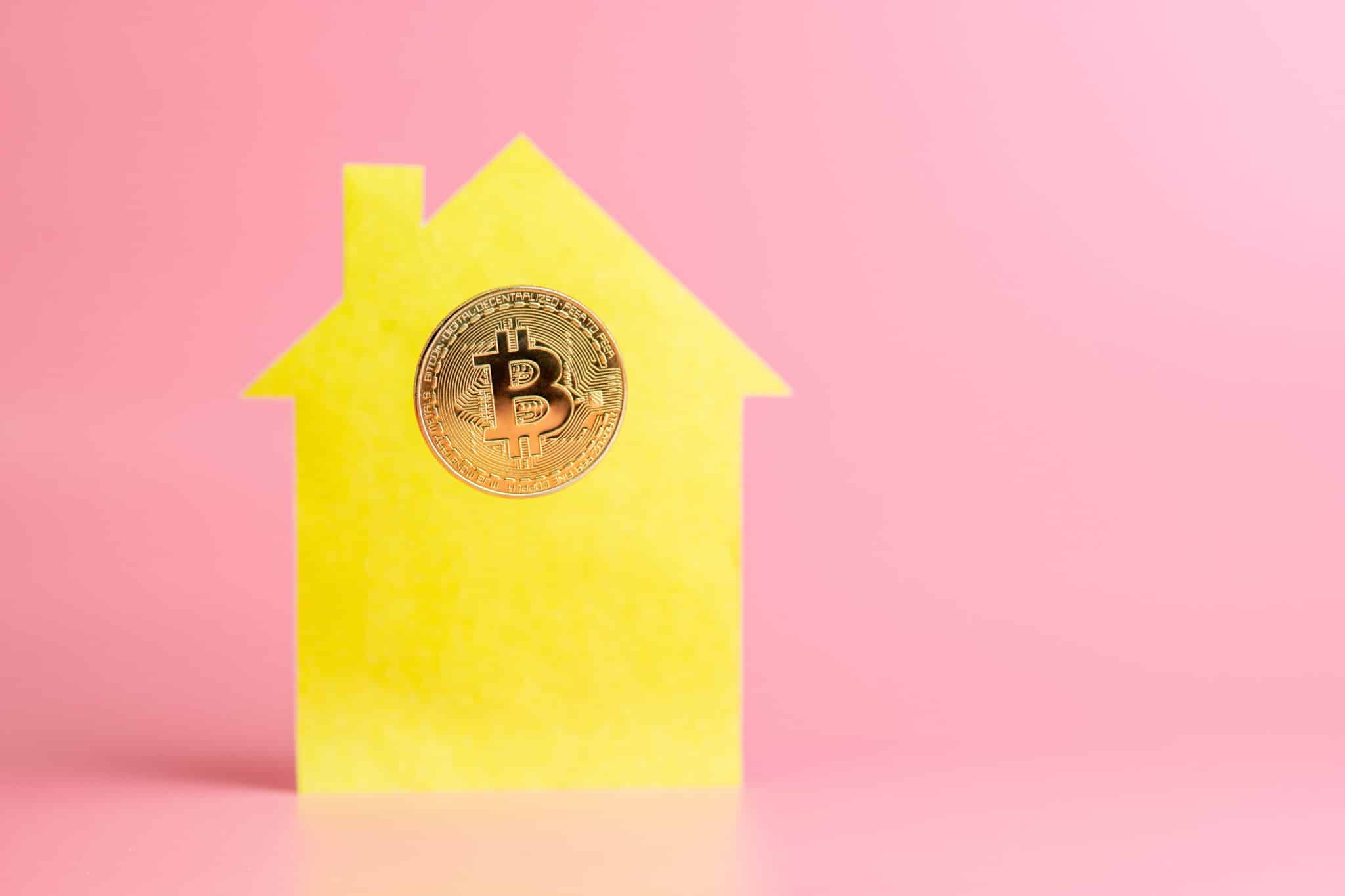 Buying or selling real estate for bitcoin, concept, copy space. Cryptocurrency investment and modern payment to landlord.