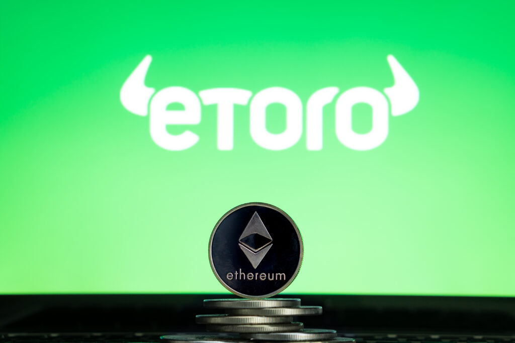 eToro logo with Ethereum coin