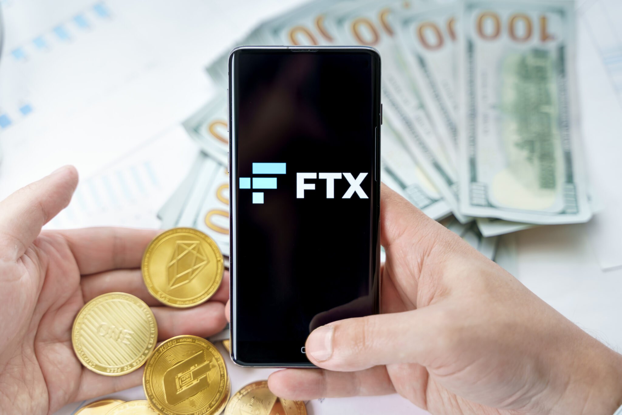Russia Moscow 20.05.2021 FTX logo in mobile phone.Cryptocurrency decentralized exchange DEX.Trading blockchain platform.Swap,buy,sell crypto token,digital coin Bitcoin,Ethereum.Business,investing.