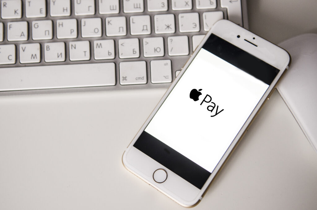 21 november, Kyiv Ukraine: white iphone on keyboard with apple pay sign , close up