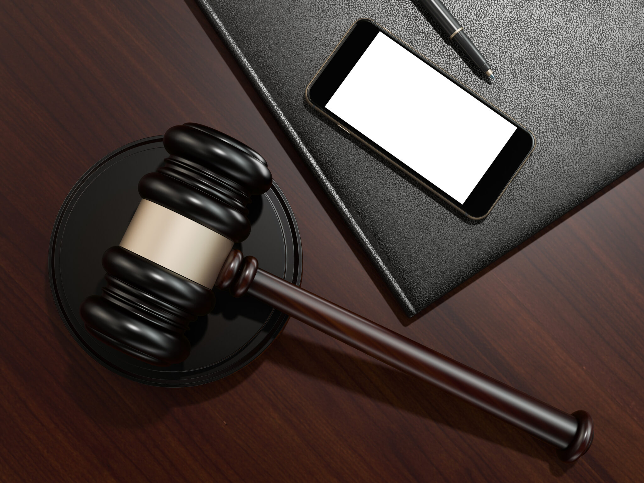 Wooden judges gavel and phone on the brown wooden background