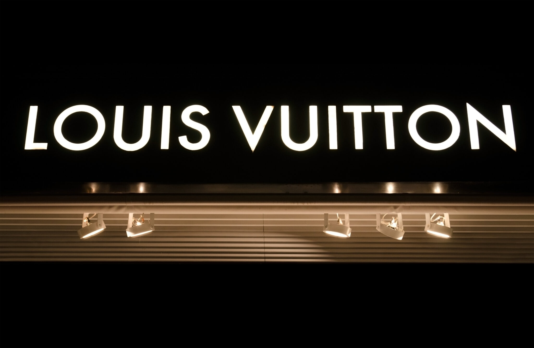 Detail of brand logo of a shop of "Louis Vuitton", Marbella, Spain.