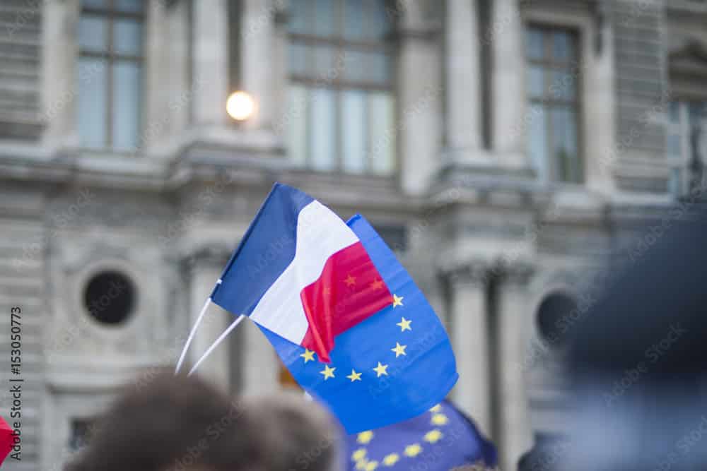 EU flags and France flags shown on a demonstration in Paris.