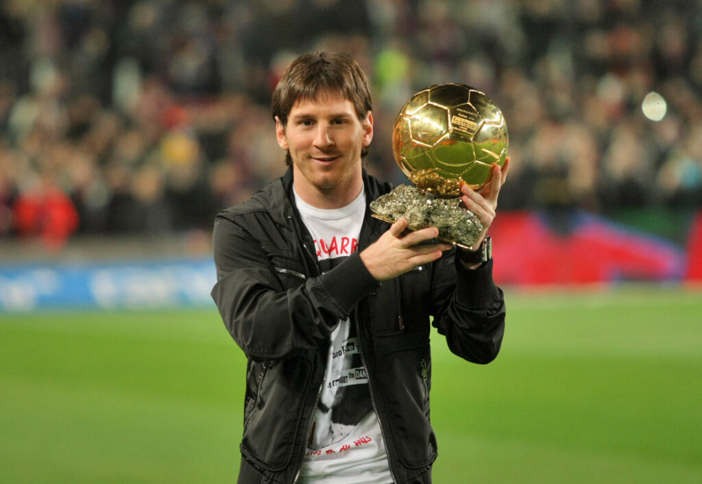 Messi holds up his Golden ball