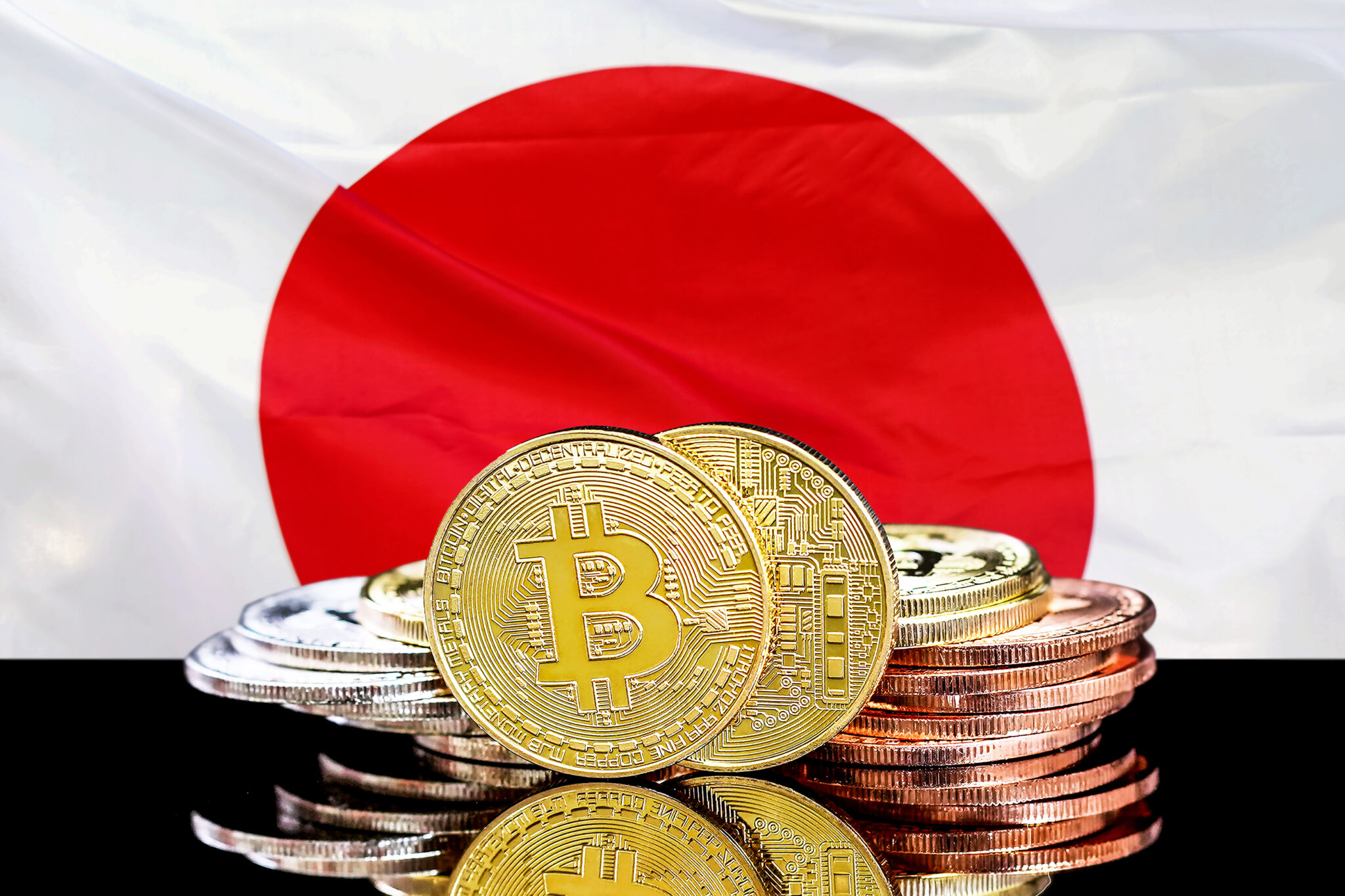Bitcoins and the flag of Japan.