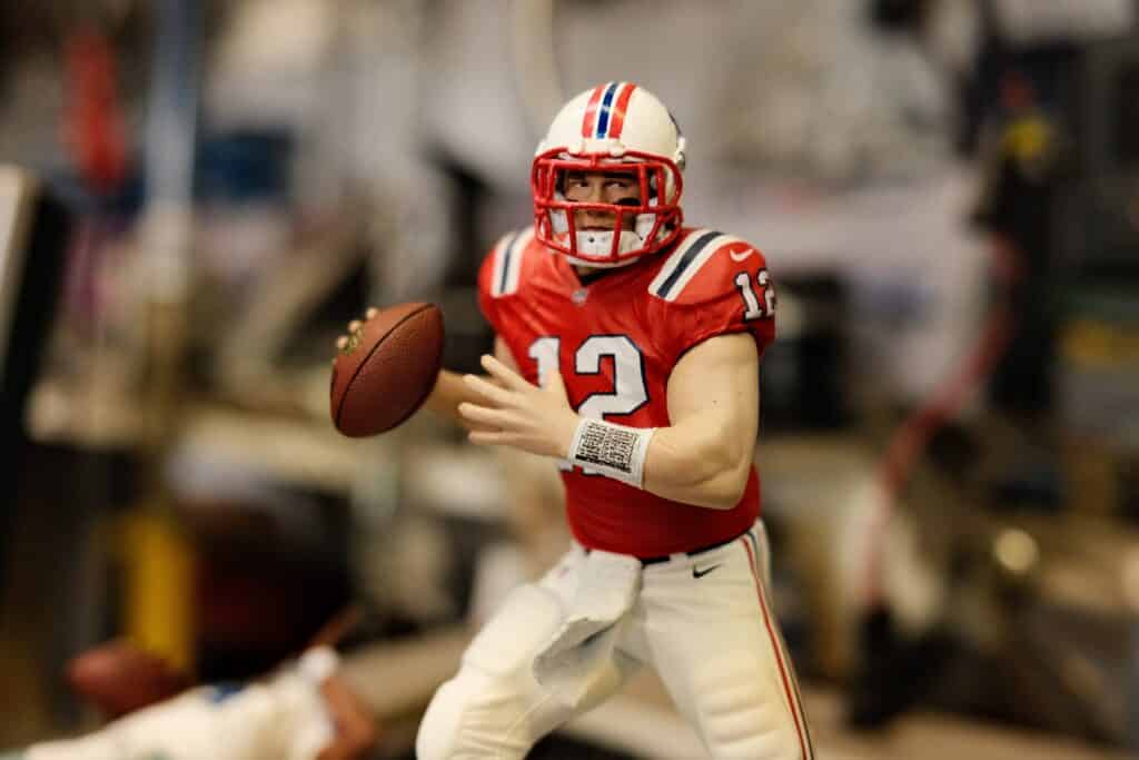 football player in red jersey shirt and white pants