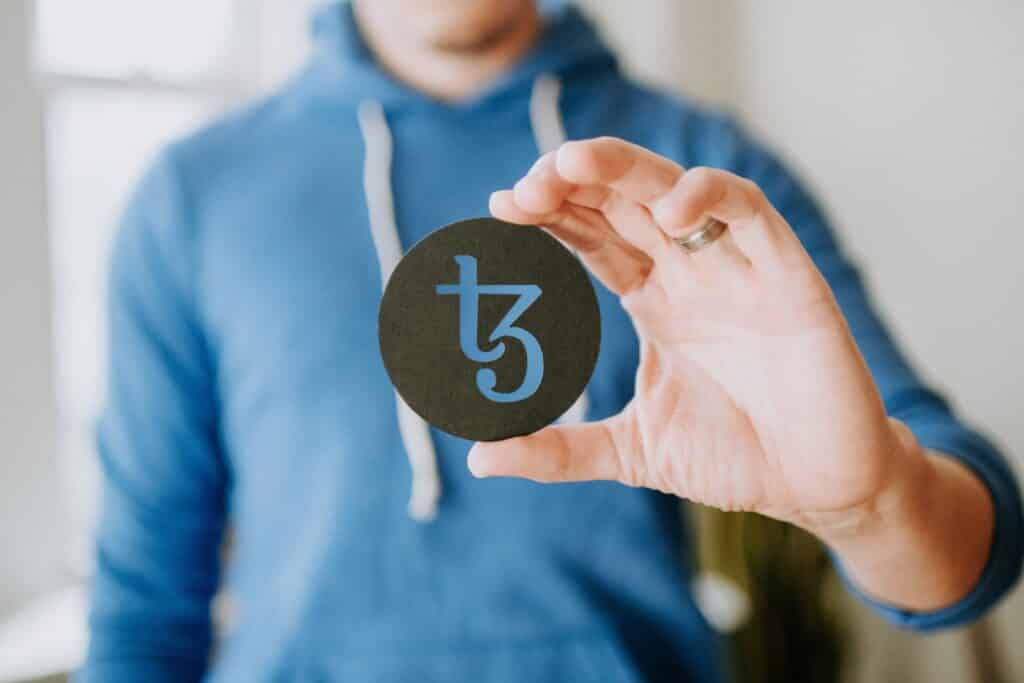 Man holding tezos cutout