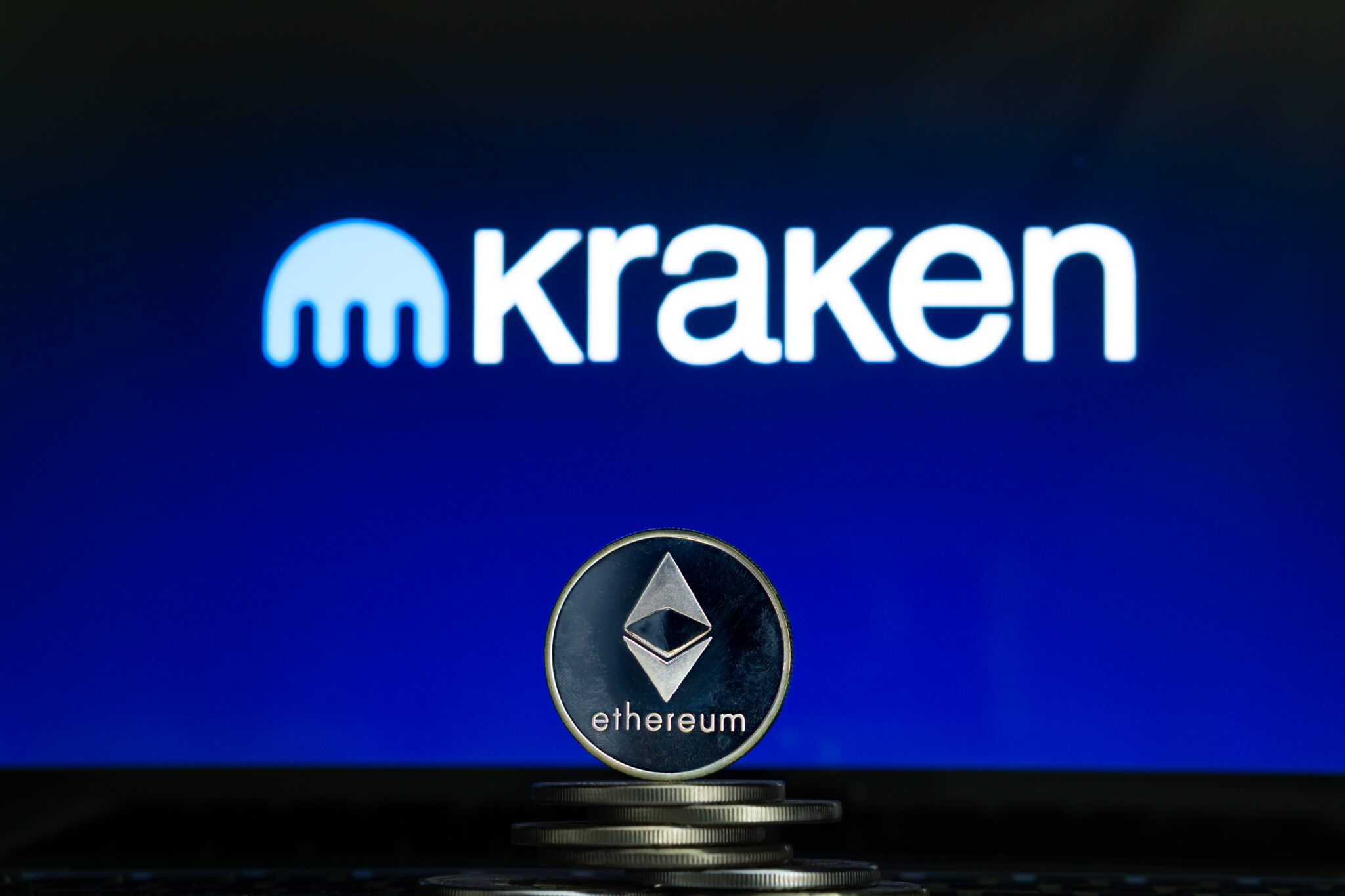 Kraken logo with Ethereum coin