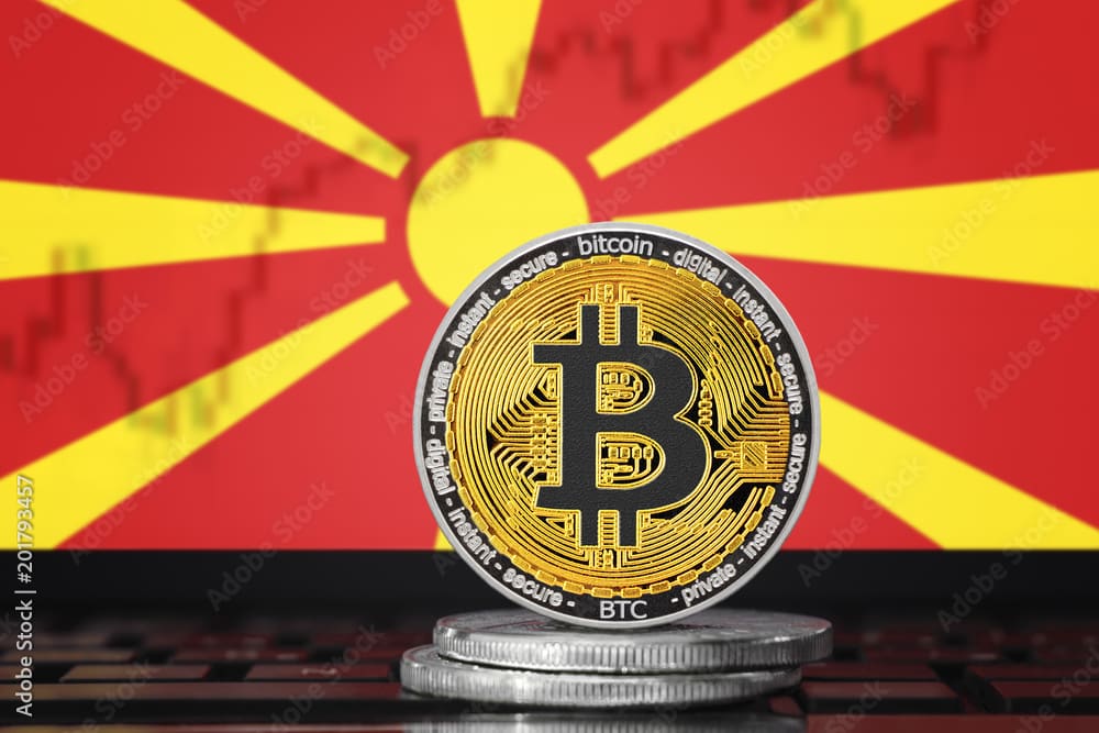 BITCOIN (BTC) cryptocurrency; coin bitcoin on the background of the flag of Macedonia