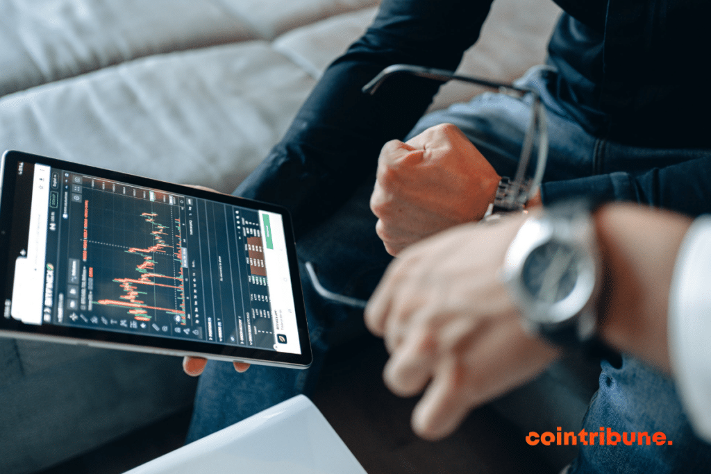 A trader viewing his charts on his tablet