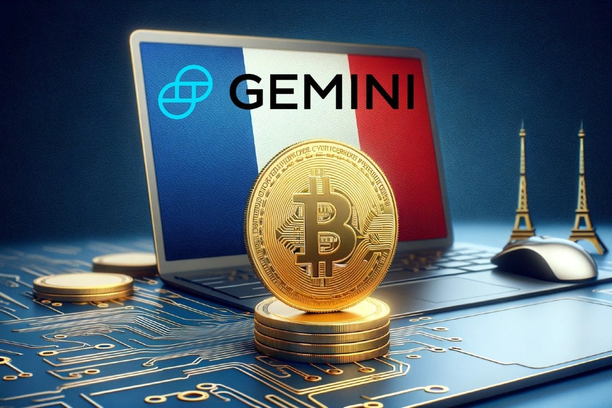 Crypto : une pièce de Bitcoin avec un drapeau de la France à l'arrière et le logo de Gemini exchange.