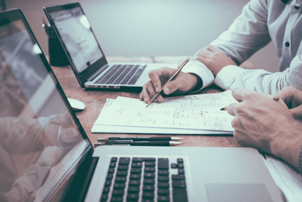 Two men are working on their financial plan.