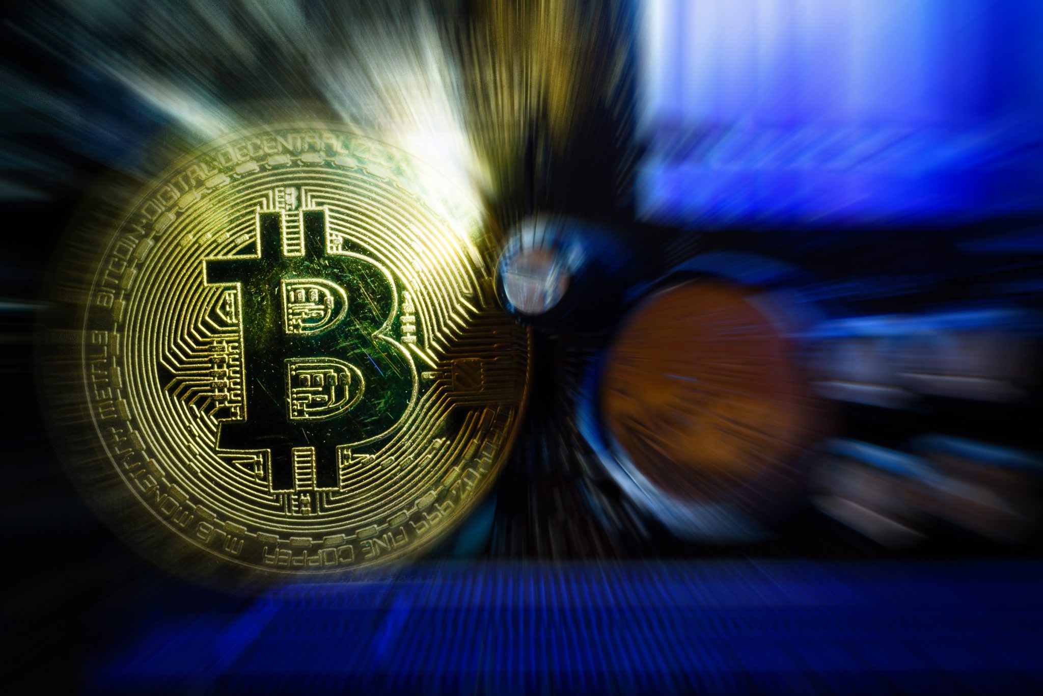 Golden bitcoin cryptocurrency on computer circuit board