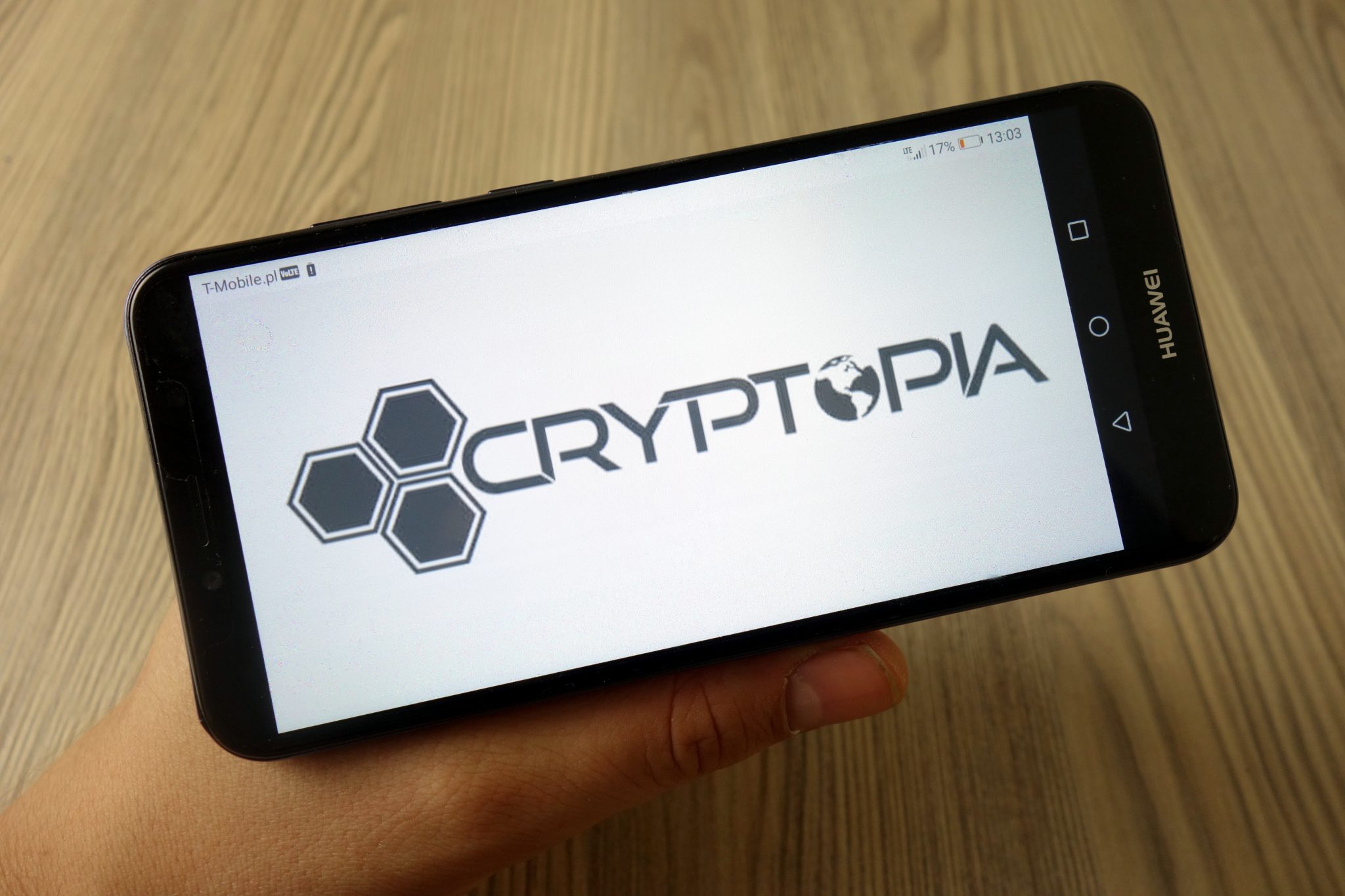 KONSKIE, POLAND - November 11, 2019: Cryptopia cryptocurrency exchange logo on mobile phone