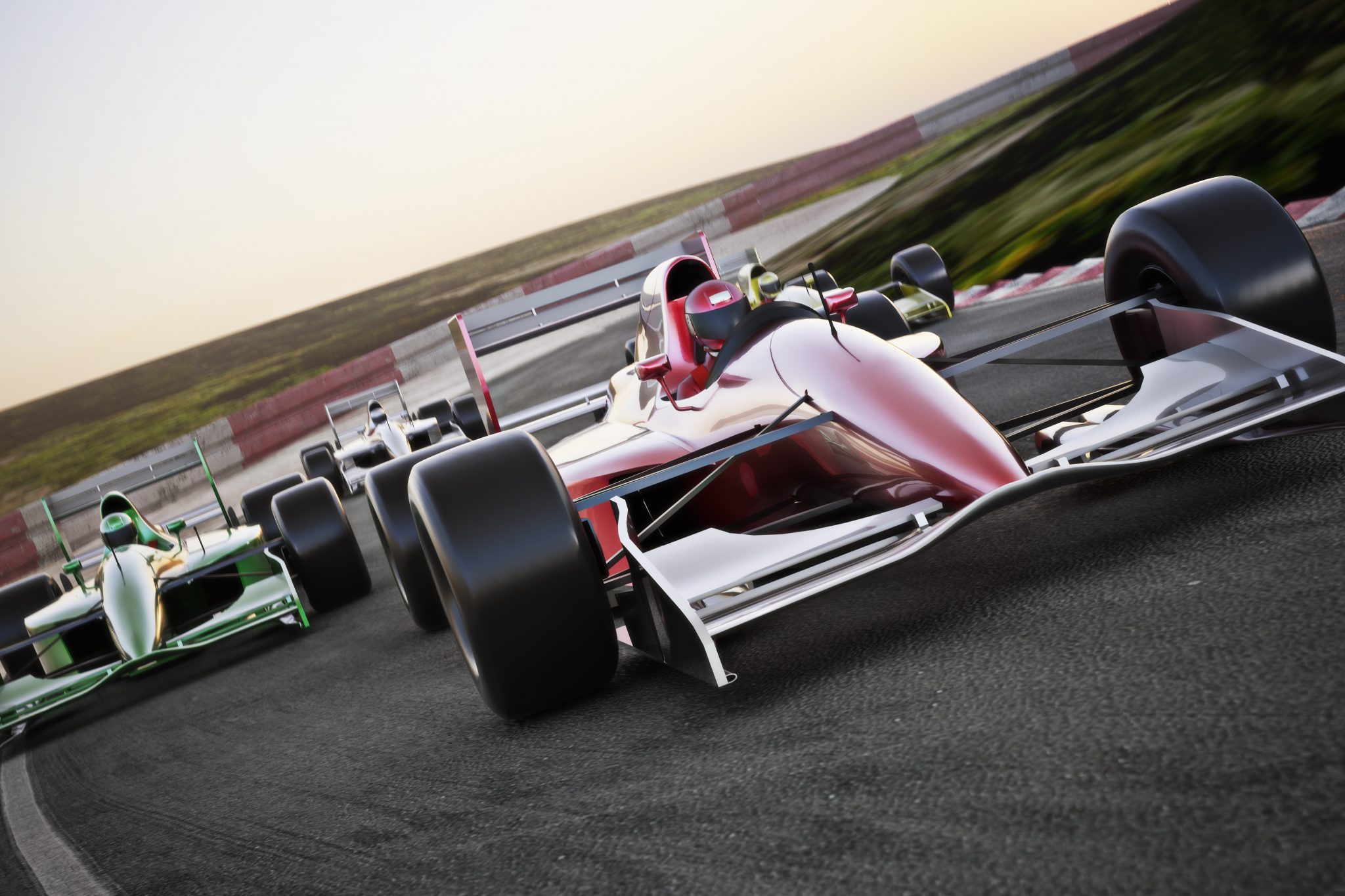Red race car close up front view on a track leading the pack with motion Blur.