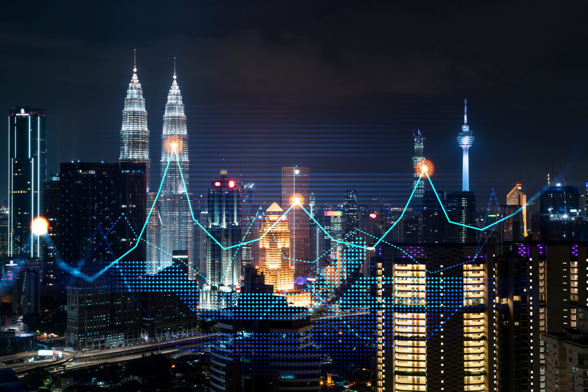 Stock market graph hologram, night panorama city view of Kuala Lumpur. KL is popular location to gain financial education in Malaysia, Asia. The concept of international research. Double exposure.